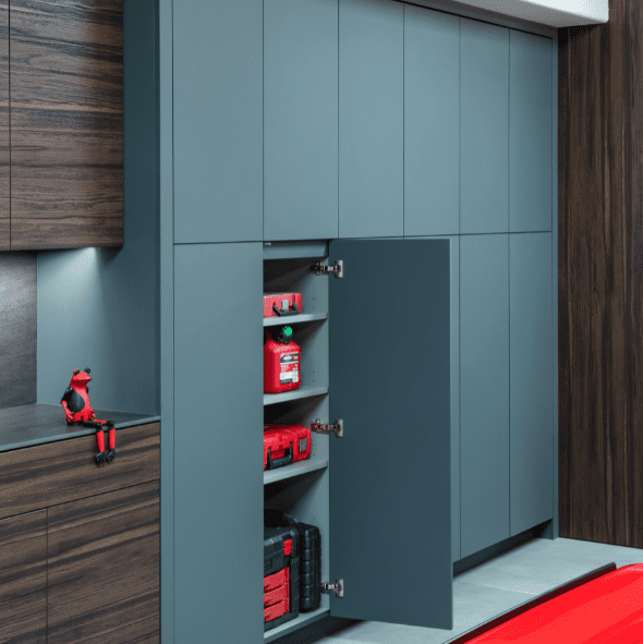 Untitled design (32) A gray cabinet with open doors displays an extinguisher, a red toolbox, and other safety items on its shelves.